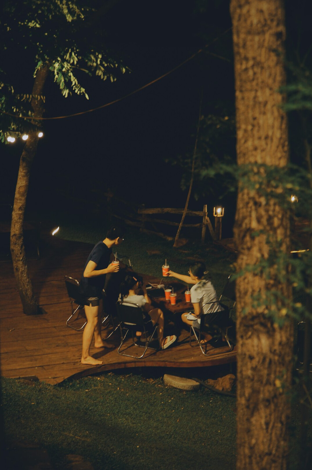 Friends gathered talking around a wooden table
